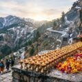 SSVP Pooja Vaishno Devi aarti lamps and flowers at the Holy Cave shrine at dawn